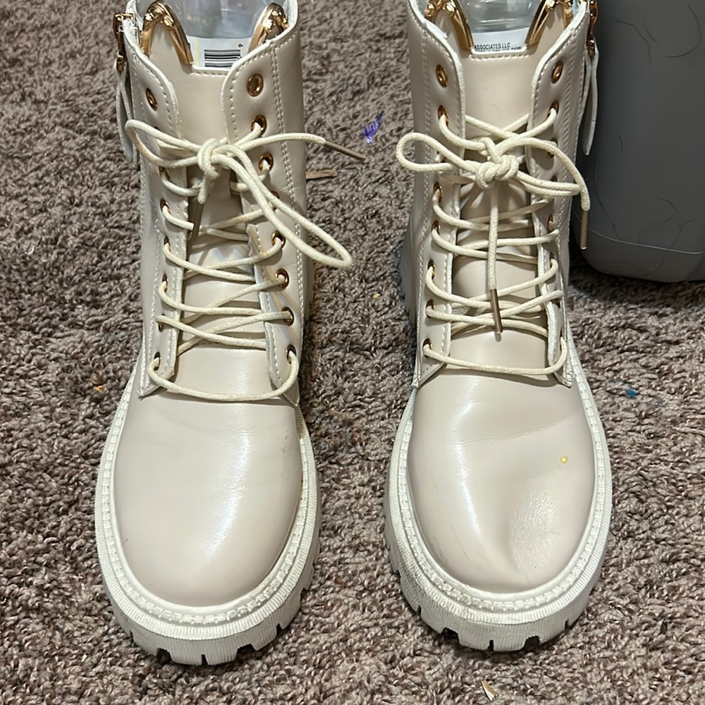 Cream colored zipped up combat boots